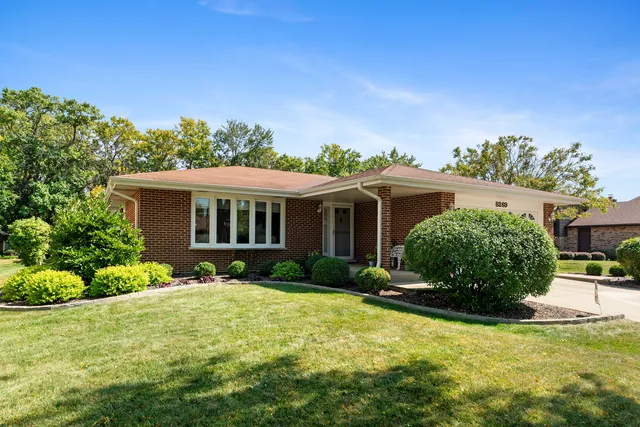 front view of a house with a yard