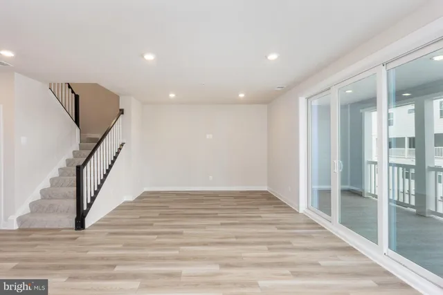 a view of an entryway with wooden floor
