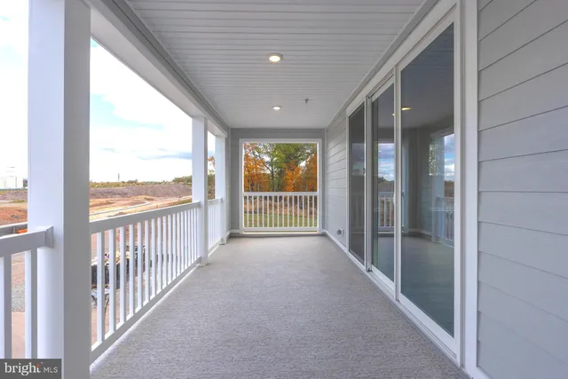 a view of balcony with furniture