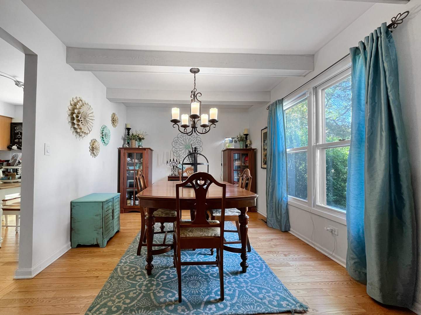 323 West Golf Road Libertyville, IL 60048 - Photo 5 of 10 a view of a dining room with furniture a chandelier and wooden floor