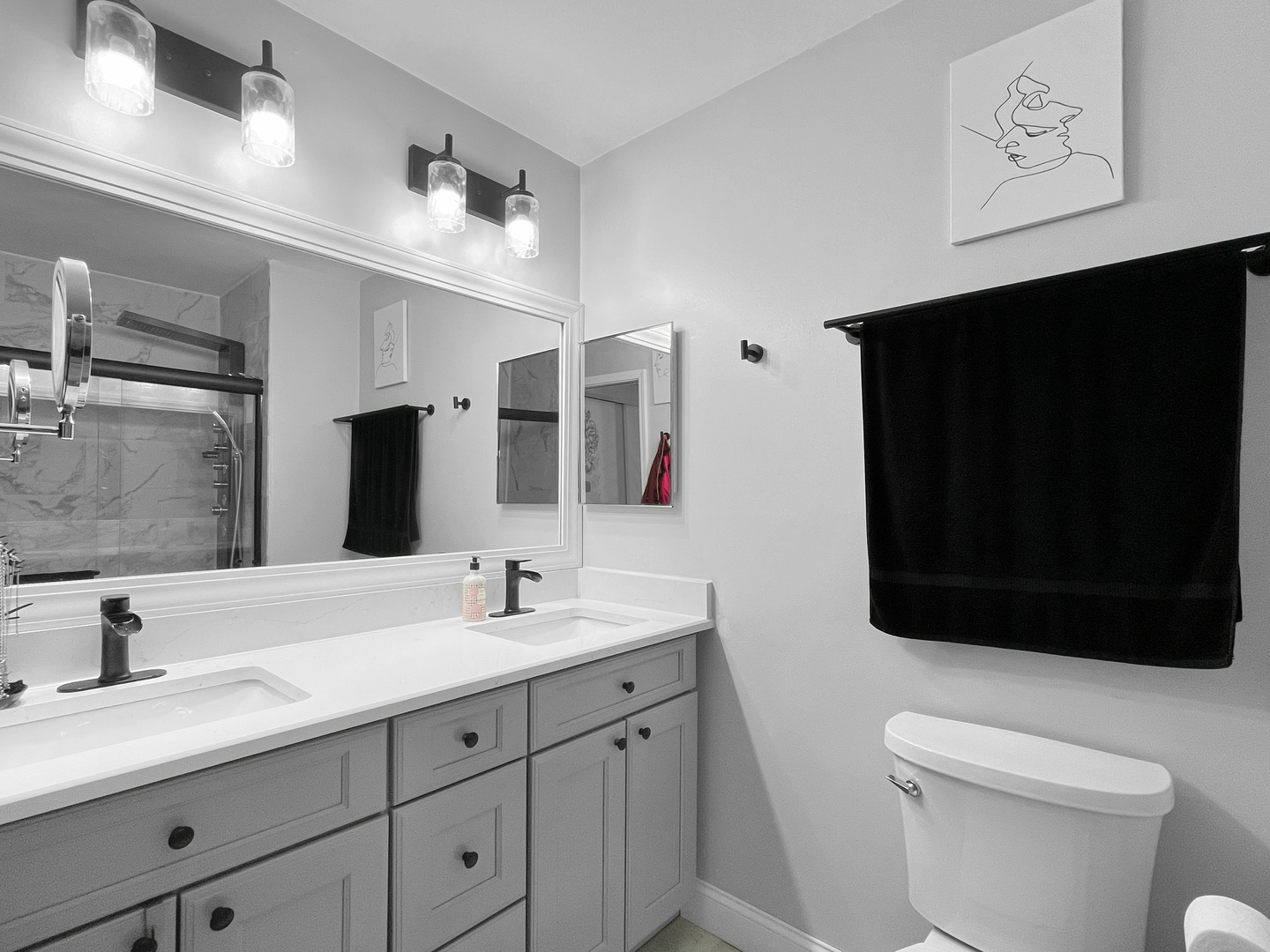 323 West Golf Road Libertyville, IL 60048 - Photo 8 of 10 a bathroom with a double vanity sink and mirror