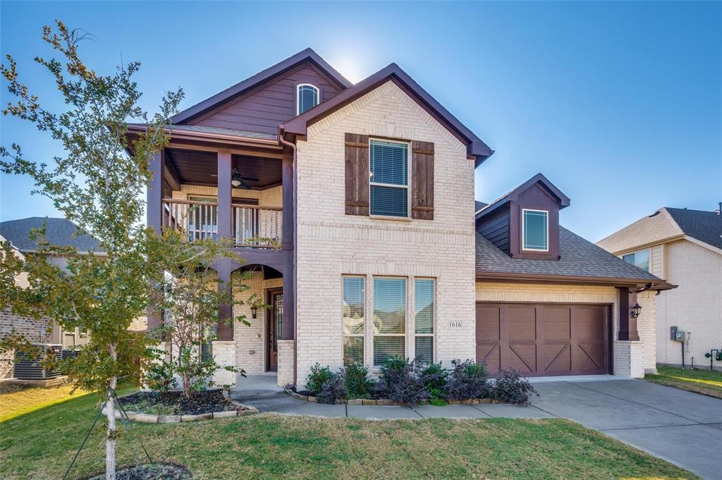 1616 George Lane Little Elm, TX 75068 - Photo 1 of 28 a front view of a house with a yard and garage