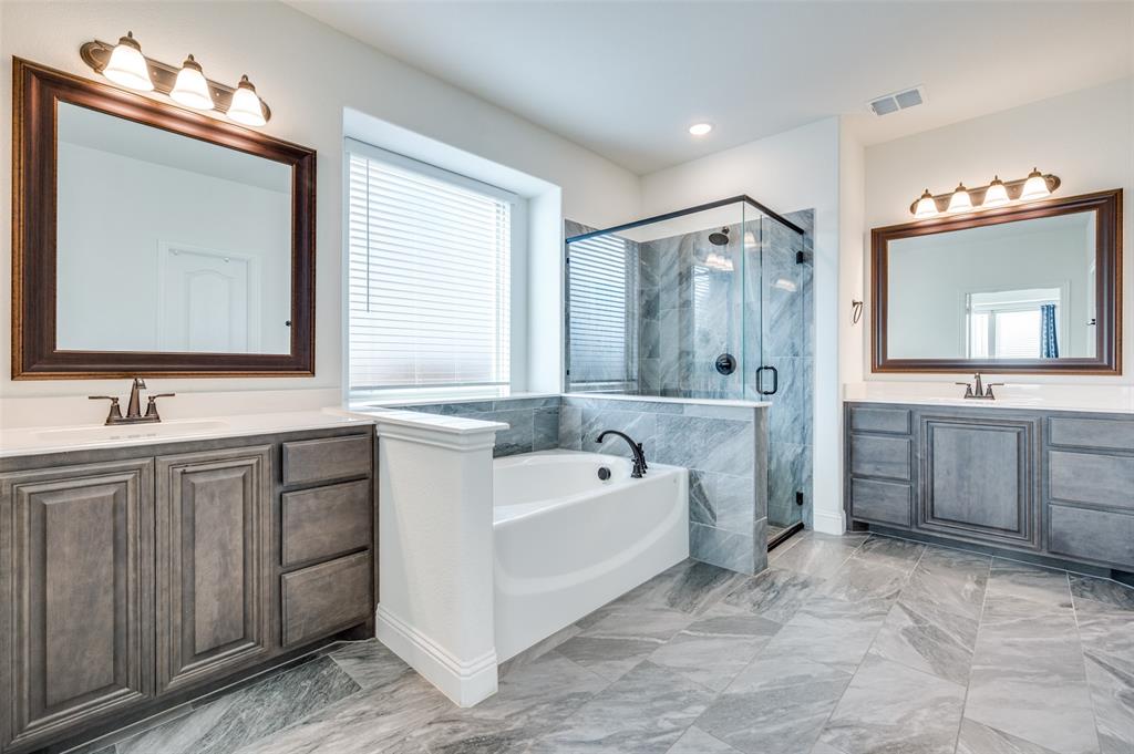 1616 George Lane Little Elm, TX 75068 - Photo 11 of 28 a spacious bathroom with a double vanity sink mirror double and bathtub