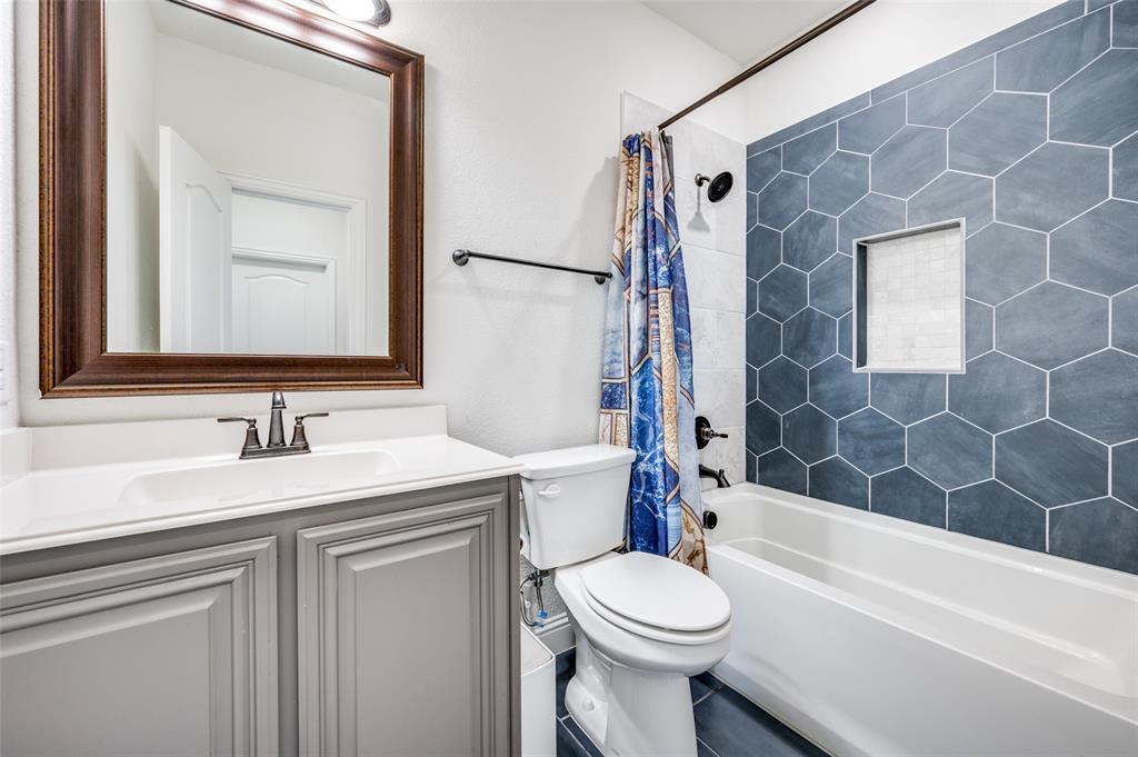 1616 George Lane Little Elm, TX 75068 - Photo 14 of 28 a bathroom with a sink a toilet and a bathtub