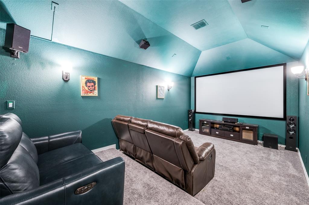 1616 George Lane Little Elm, TX 75068 - Photo 17 of 28 a living room with furniture and a projector screen
