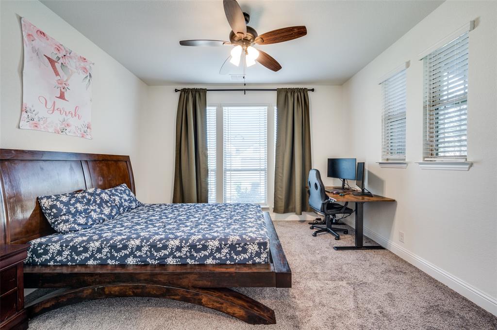 1616 George Lane Little Elm, TX 75068 - Photo 20 of 28 a bedroom with a bed dresser and a window
