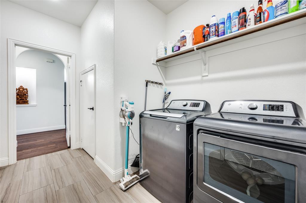 1616 George Lane Little Elm, TX 75068 - Photo 22 of 28 a utility room with dryer and washer