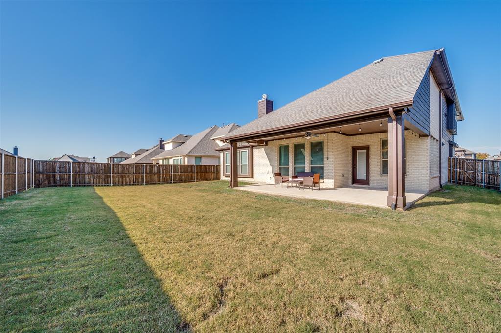1616 George Lane Little Elm, TX 75068 - Photo 25 of 28 a view of a house with backyard and porch