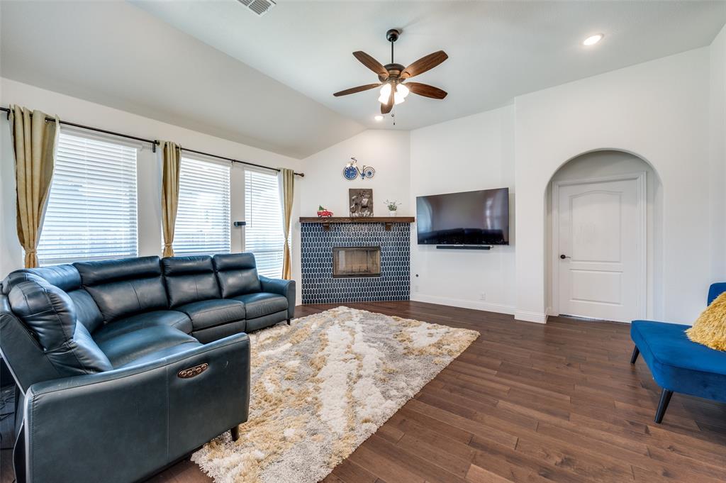 1616 George Lane Little Elm, TX 75068 - Photo 3 of 28 a living room with furniture flat screen tv and wooden floor