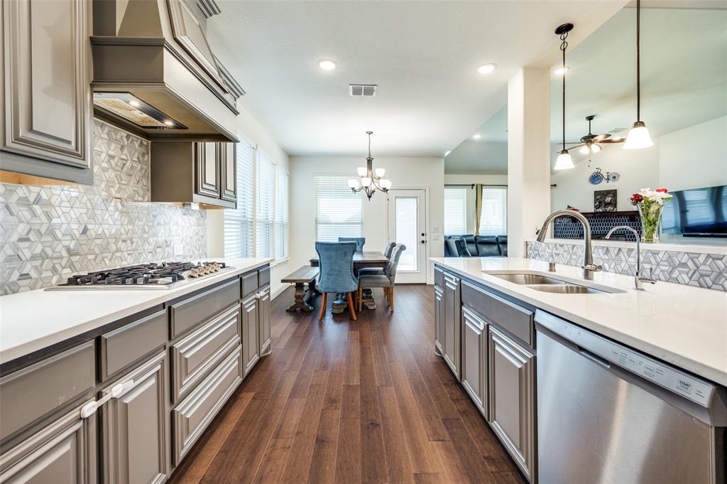 1616 George Lane Little Elm, TX 75068 - Photo 7 of 28 a kitchen with sink stove and chairs