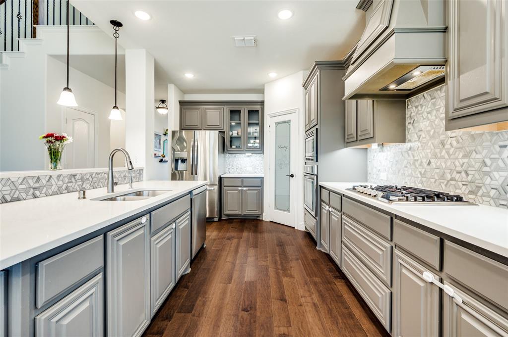 1616 George Lane Little Elm, TX 75068 - Photo 8 of 28 a kitchen with sink stove and refrigerator