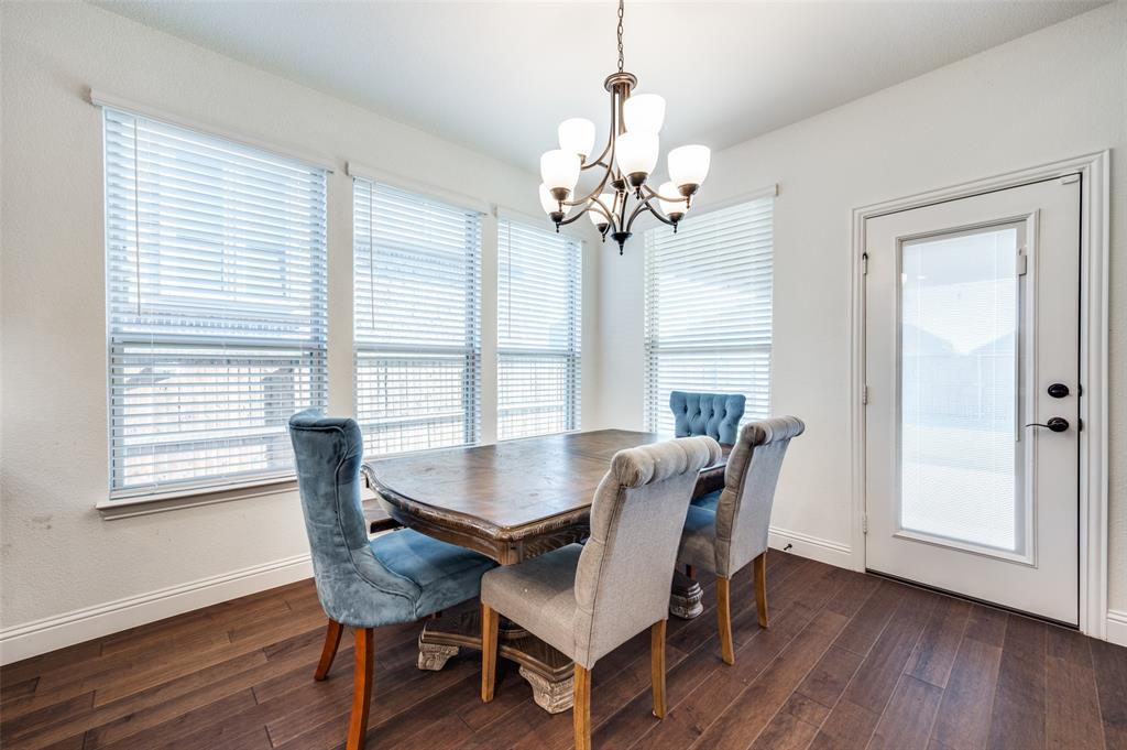 1616 George Lane Little Elm, TX 75068 - Photo 9 of 28 a view of a dining room with furniture window and wooden floor