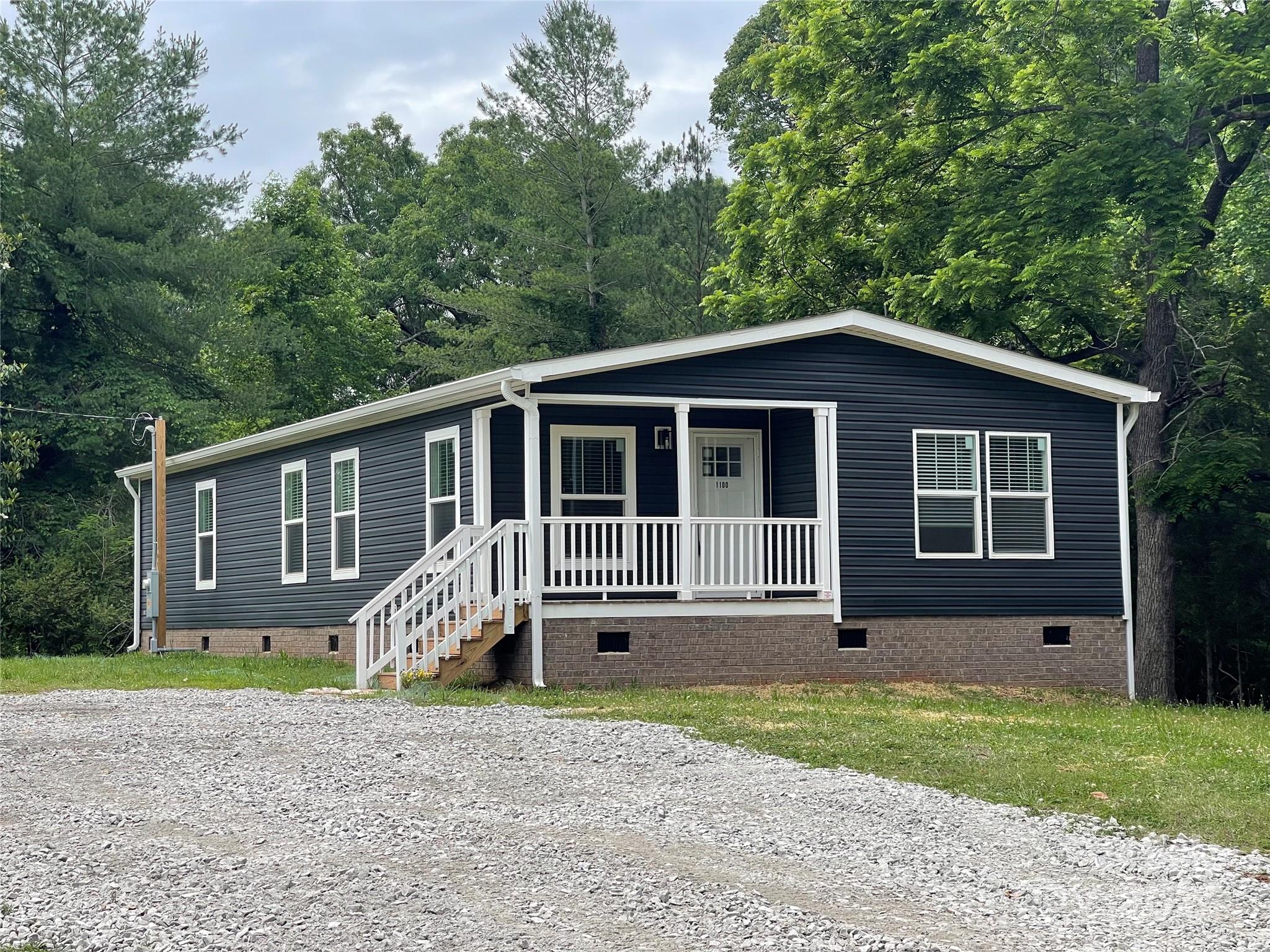 1100 Turkey Creek Ridge Road York, SC 29745 - Photo 1 of 28 a front view of a house with garden