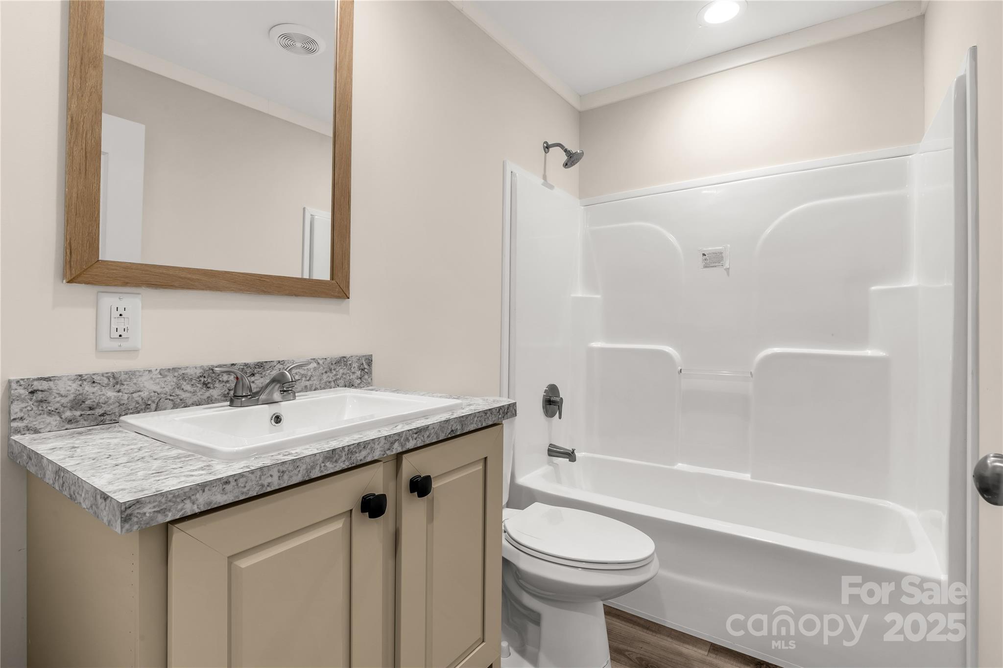 1100 Turkey Creek Ridge Road York, SC 29745 - Photo 18 of 28 a bathroom with a granite countertop sink toilet mirror and bathtub