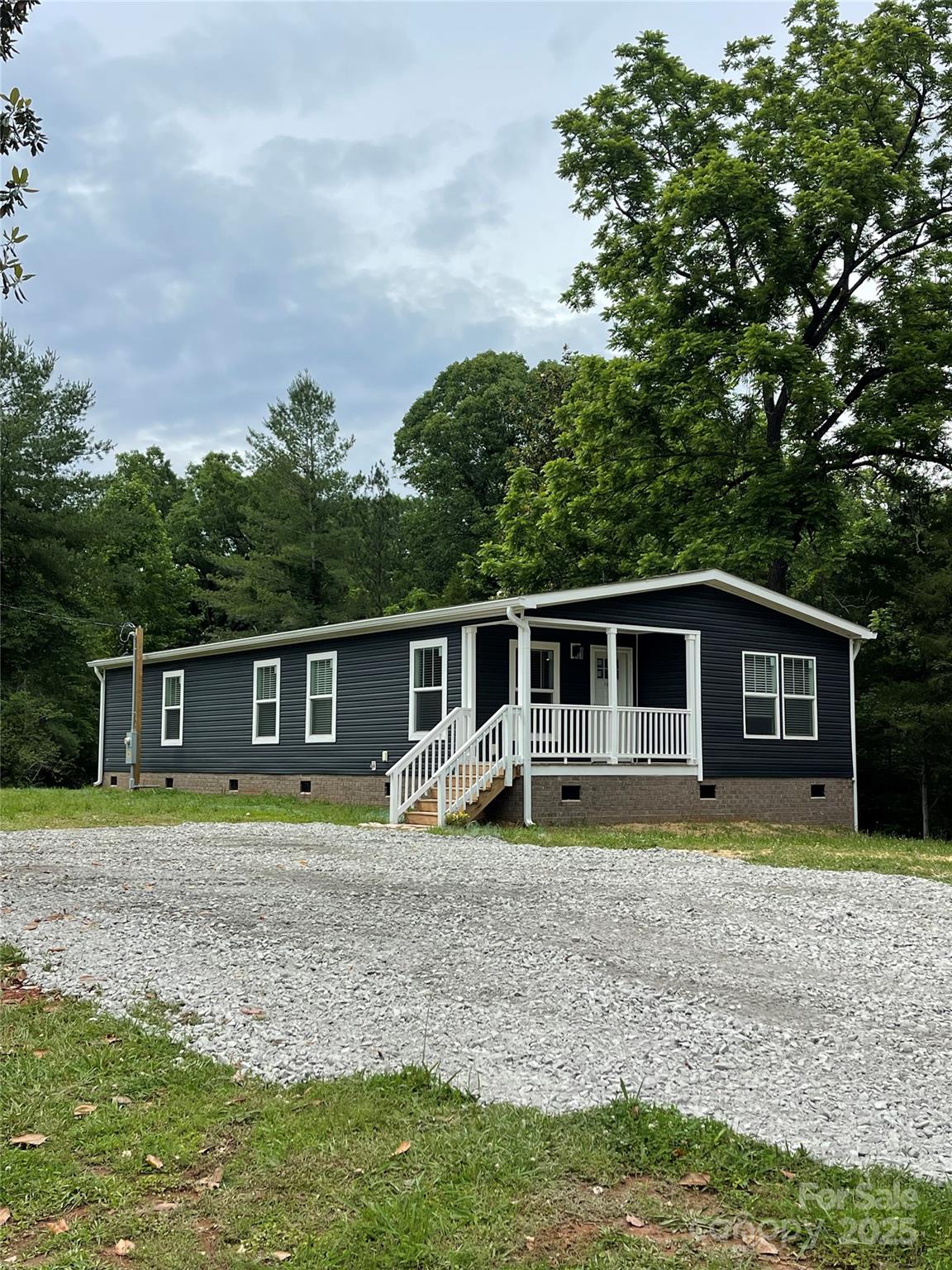 1100 Turkey Creek Ridge Road York, SC 29745 - Photo 2 of 28 a view of a house with a yard and large trees