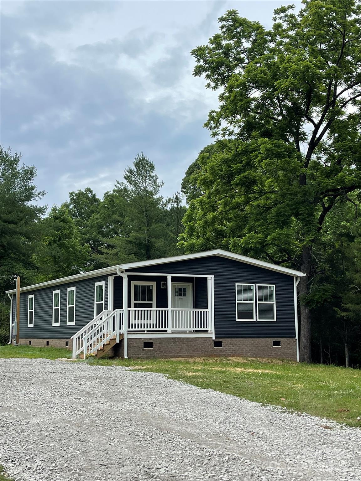 1100 Turkey Creek Ridge Road York, SC 29745 - Photo 24 of 28 a front view of a house with a garden