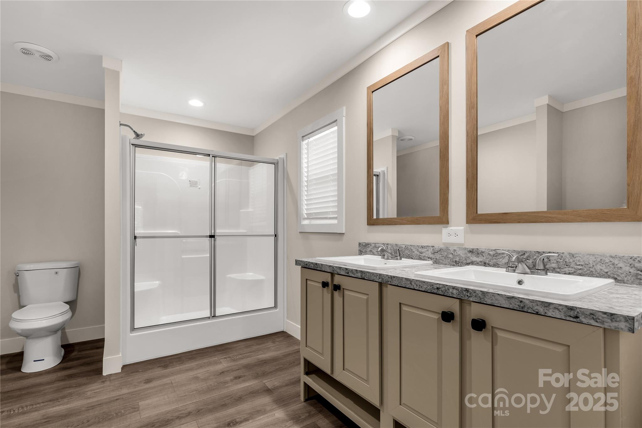1100 Turkey Creek Ridge Road York, SC 29745 - Photo 7 of 28 a bathroom with a granite countertop sink a toilet and a large mirror