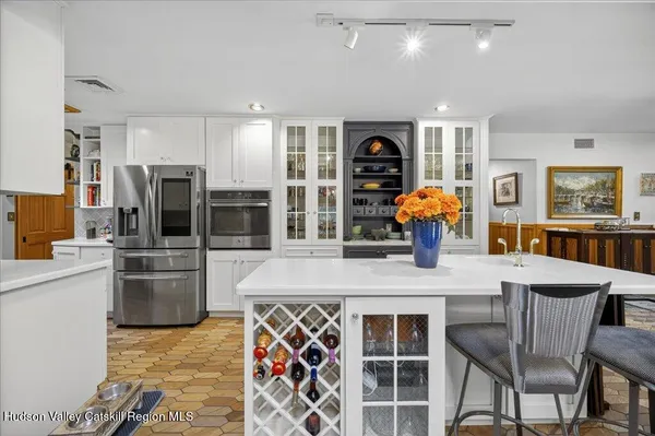 a view of a dining room with furniture and chandelier