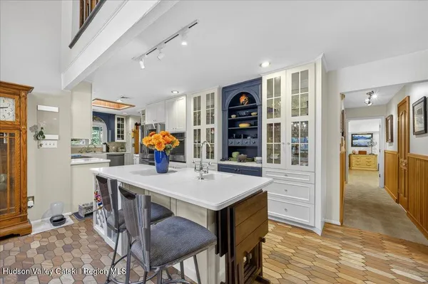 a kitchen with a sink stove and microwave