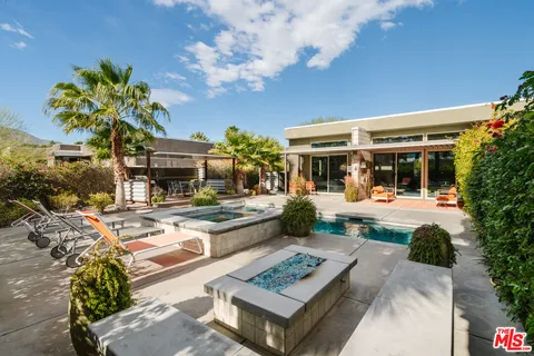 a view of a dinning table and chair in the patio