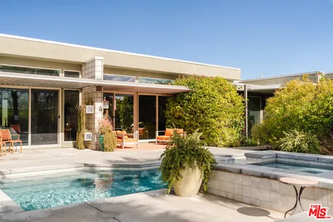 a view of a swimming pool with a patio