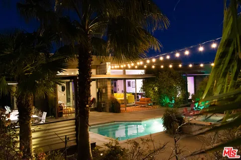 a view of swimming pool with a patio