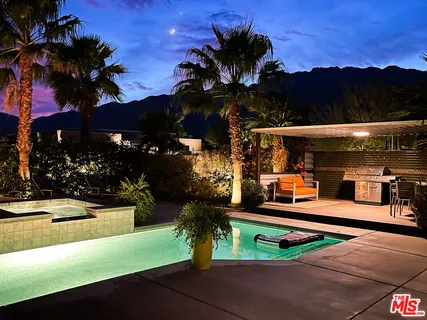 a view of a swimming pool with a patio