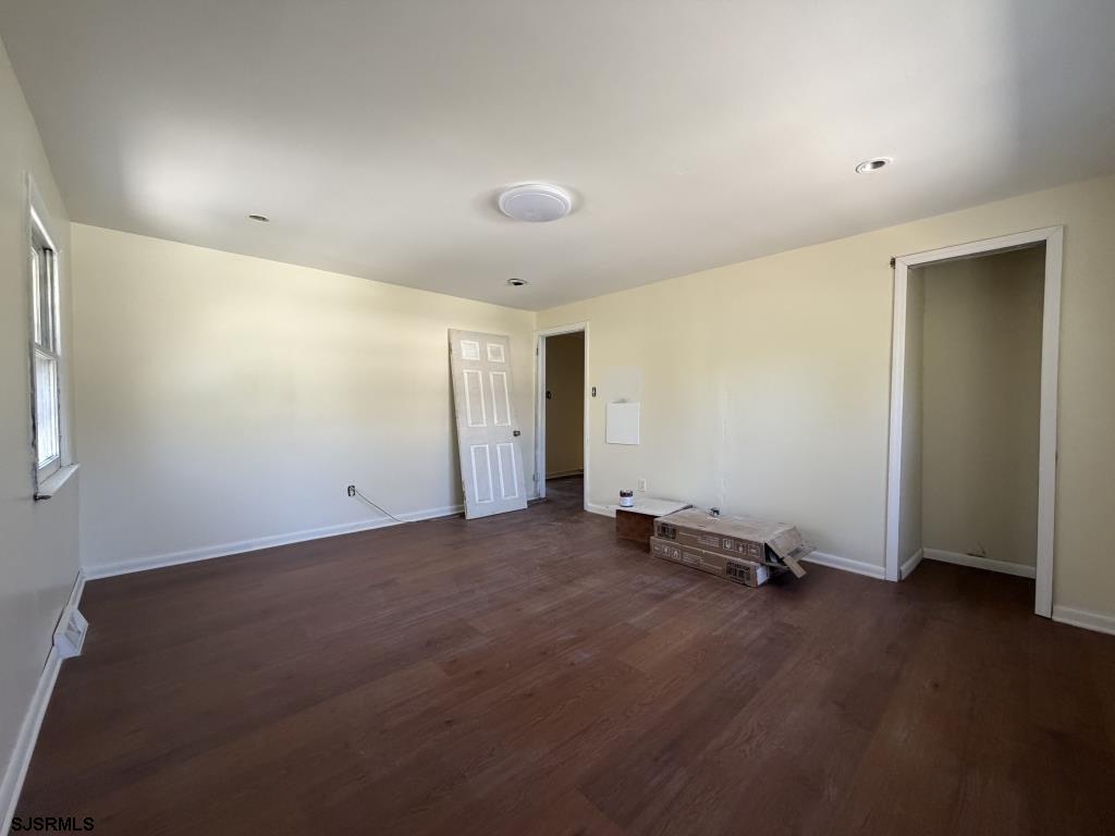 322 West Nicholson Road Mount Ephraim, NJ 08059 - Photo 19 of 47 an empty room with wooden floor and windows