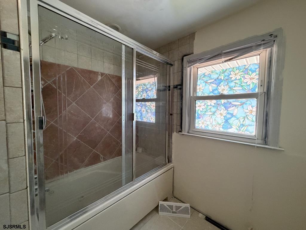 322 West Nicholson Road Mount Ephraim, NJ 08059 - Photo 22 of 47 a bathroom with a glass shower door