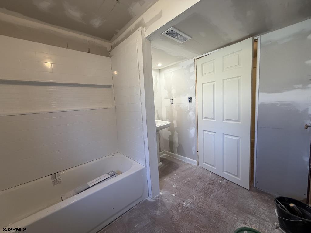 322 West Nicholson Road Mount Ephraim, NJ 08059 - Photo 26 of 47 a bathroom with a bathtub and a shower