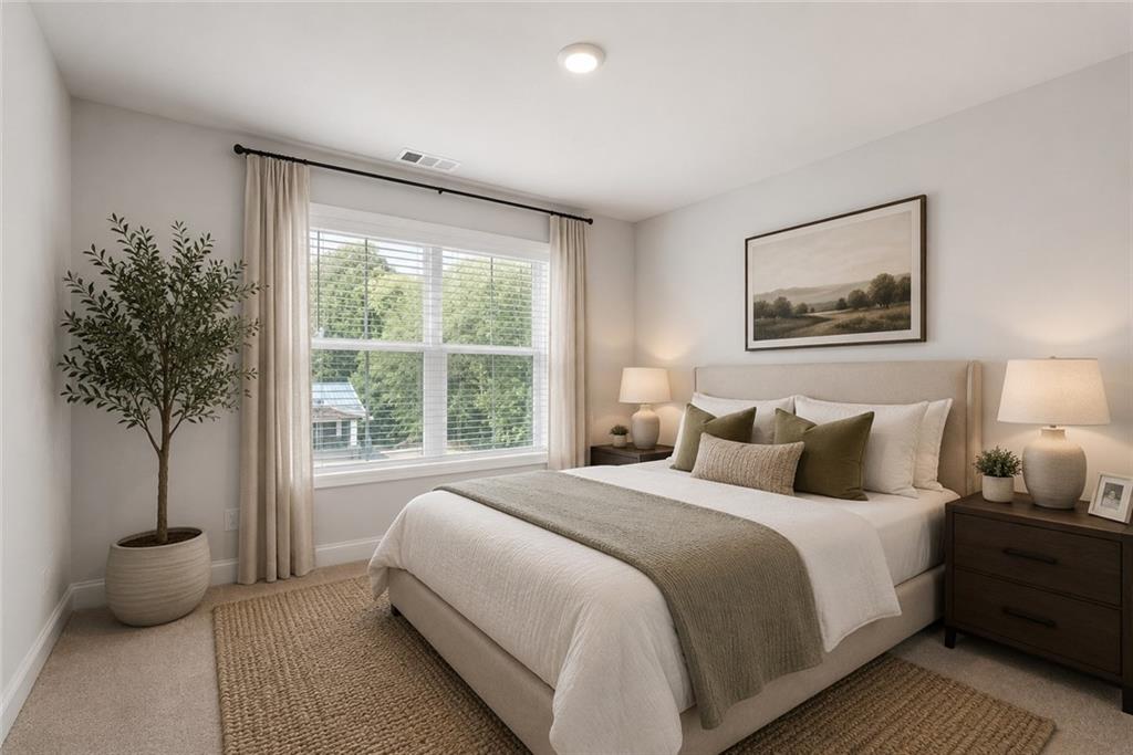 3334 Swallowtail Terrace Duluth, GA 30096 - Photo 30 of 37 a bedroom with a large bed and a potted plant