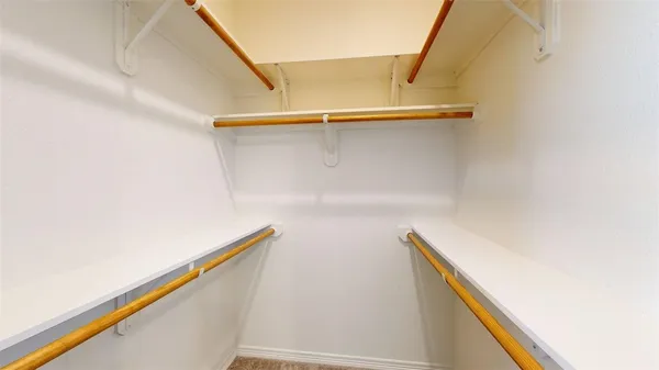 a bathroom with a tub a sink and a mirror