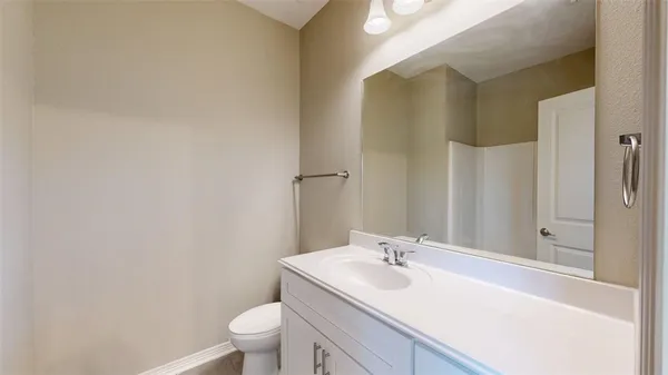 a spacious bathroom with a granite countertop sink a mirror and shower