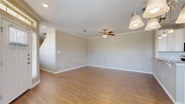 a view of an entryway with wooden floor