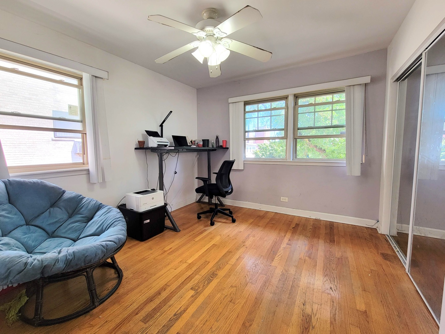 7538 North Ridge Boulevard, Unit 3E Chicago, IL 60645 - Photo 14 of 20 a living room with furniture and a wooden floor