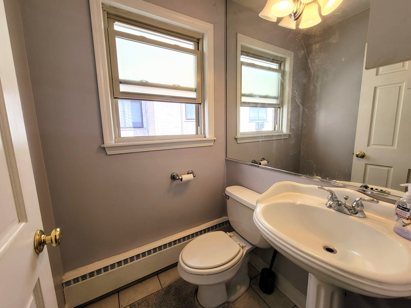 7538 North Ridge Boulevard, Unit 3E Chicago, IL 60645 - Photo 15 of 20 a bathroom with a sink and a toilet
