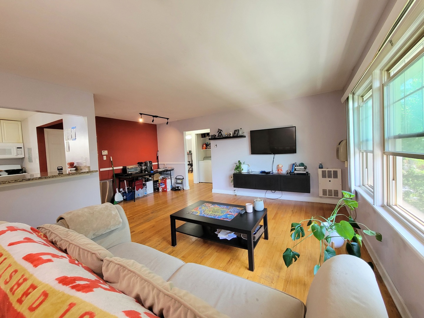 7538 North Ridge Boulevard, Unit 3E Chicago, IL 60645 - Photo 6 of 20 a living room with furniture and a flat screen tv