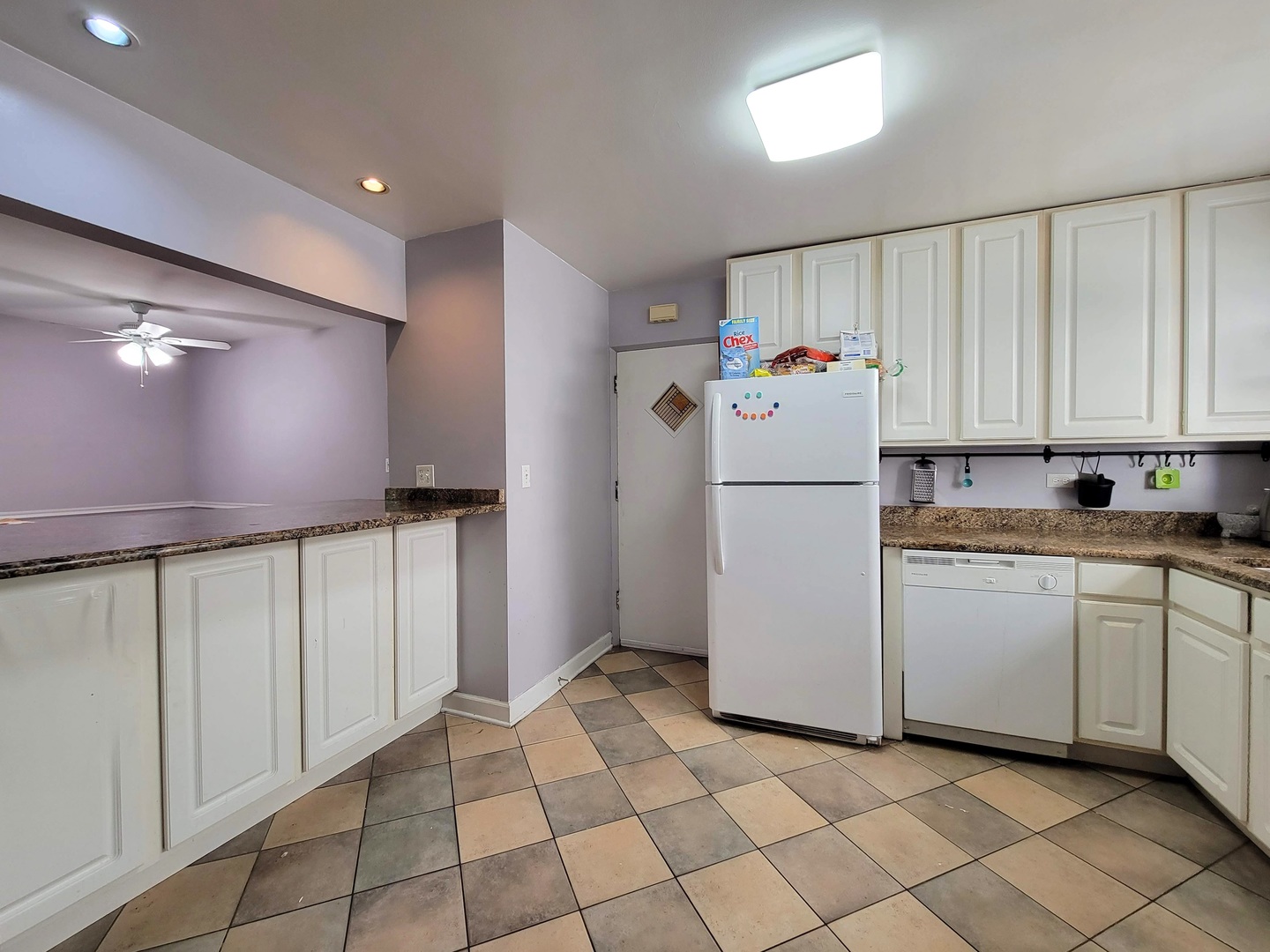 7538 North Ridge Boulevard, Unit 3E Chicago, IL 60645 - Photo 8 of 20 a white refrigerator freezer sitting in a kitchen