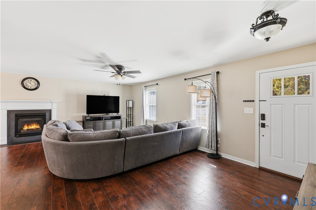 28820 Butler Branch Road Petersburg, VA 23805 - Photo 12 of 27 a living room with furniture and a flat screen tv
