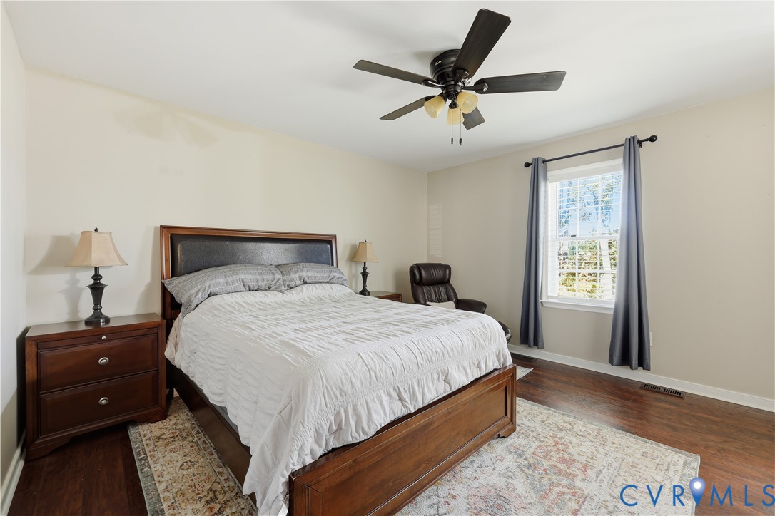 28820 Butler Branch Road Petersburg, VA 23805 - Photo 13 of 27 a bedroom with a bed and a window