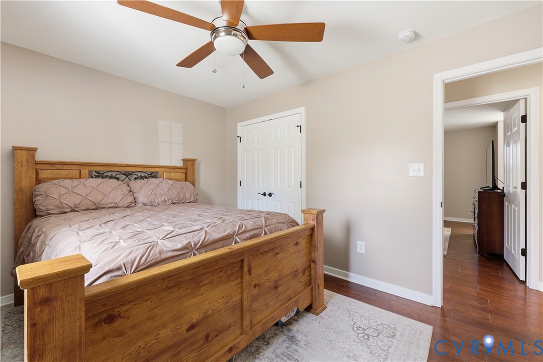 28820 Butler Branch Road Petersburg, VA 23805 - Photo 17 of 27 a bedroom with a bed and a walk in closet