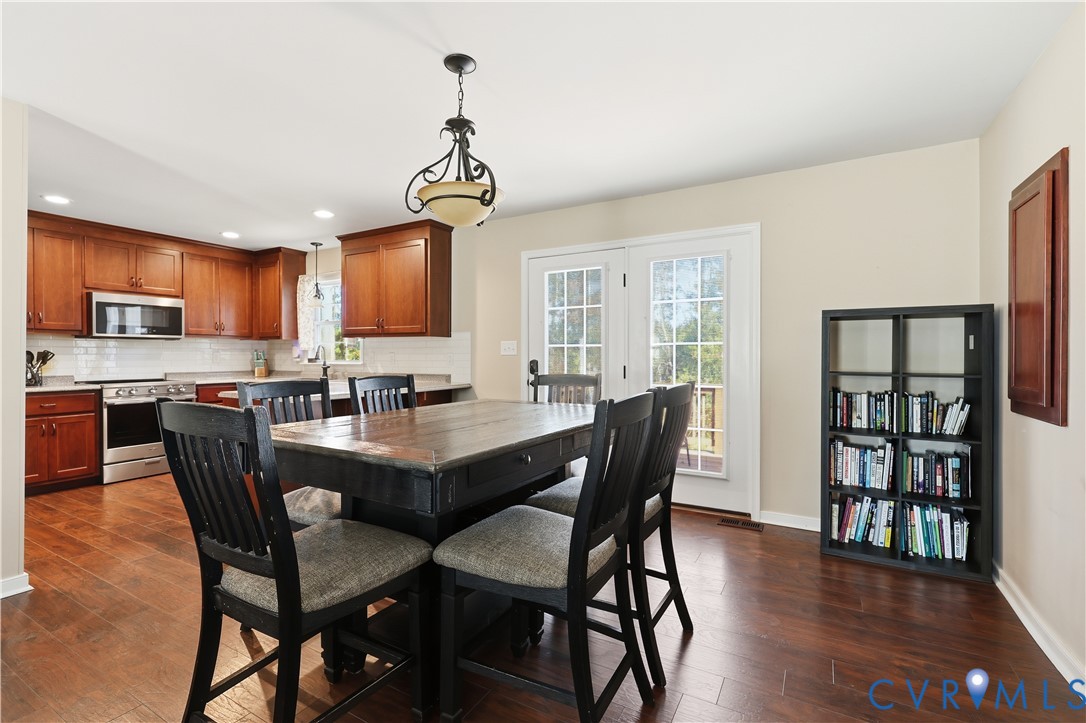 28820 Butler Branch Road Petersburg, VA 23805 - Photo 7 of 27 a view of a dining room with furniture window and wooden floor