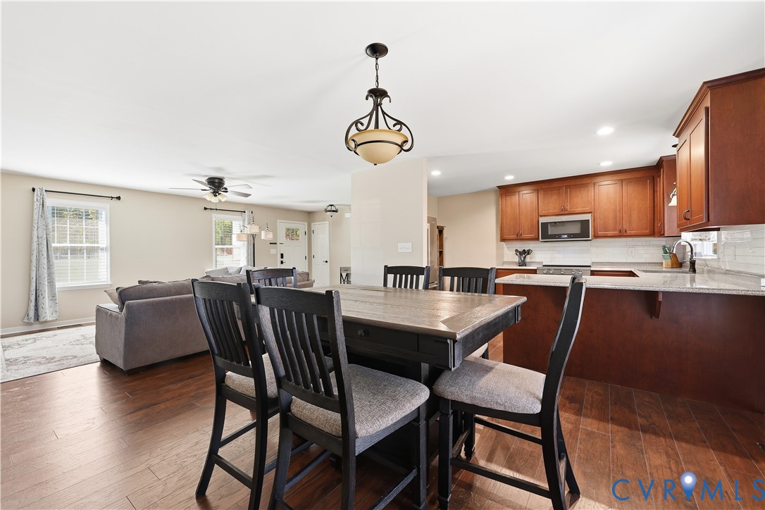 28820 Butler Branch Road Petersburg, VA 23805 - Photo 8 of 27 a dining room with furniture a window and wooden floor