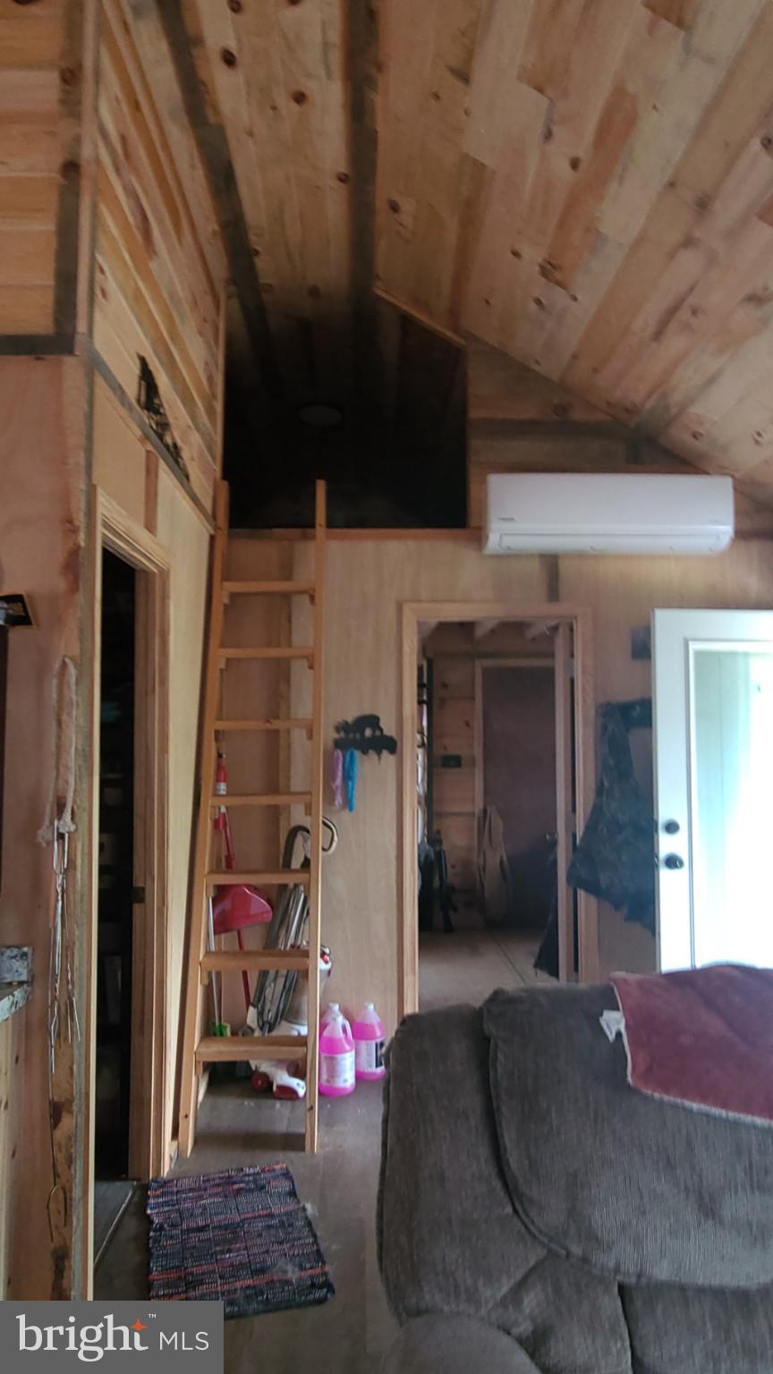 534 Co Rte 10/2 Franklin, WV 26807 - Photo 9 of 39 Cozy cabin interior with rustic charm.