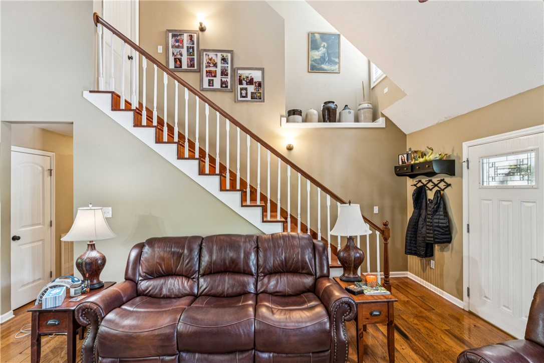 189 Little Choestoea Road Westminster, SC 29693 - Photo 7 of 38 This inviting living space features gleaming hardwood floors and a striking staircase.