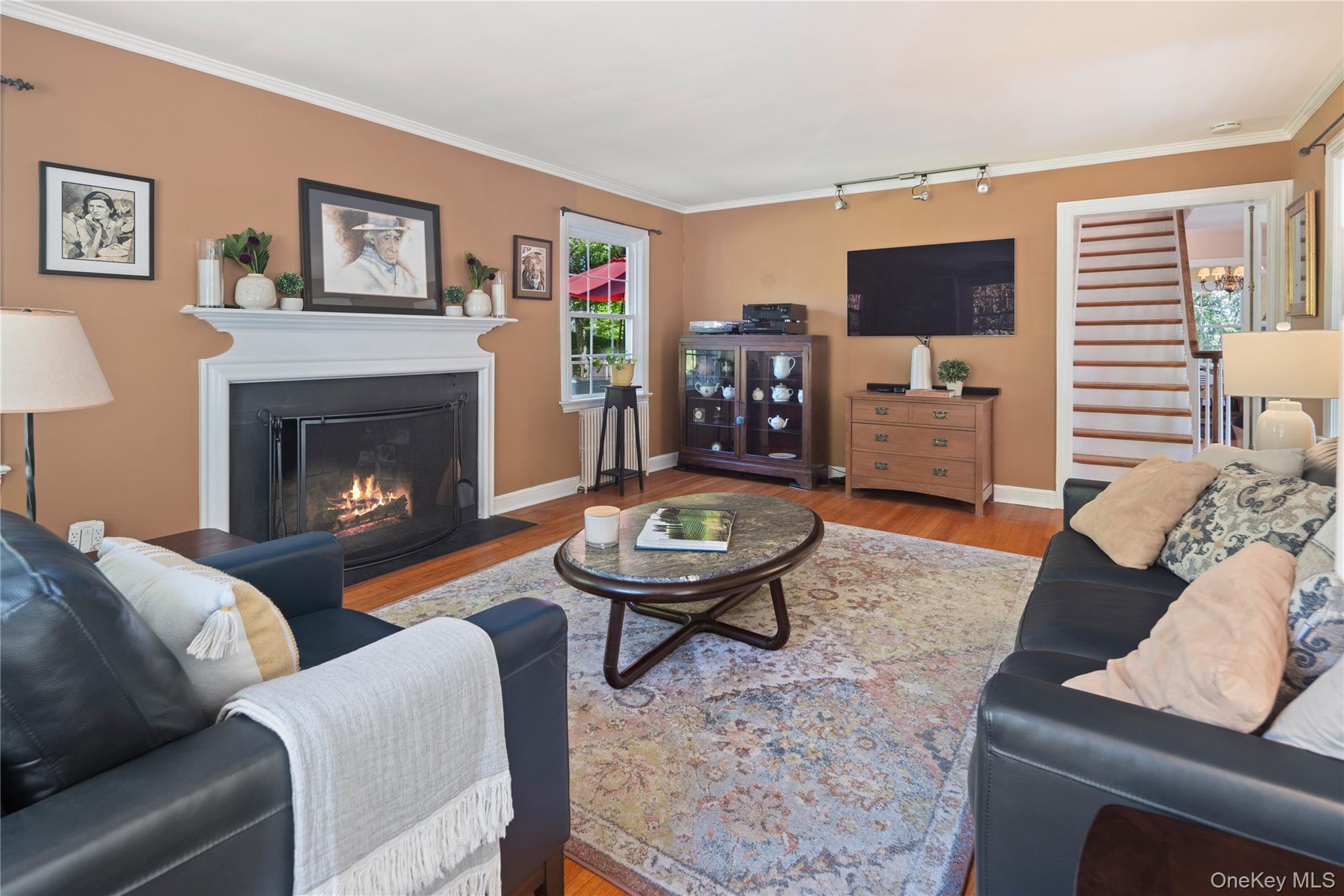 611 Decatur Avenue Peekskill, NY 10566 - Photo 26 of 50 The wood-burning fireplace provides a cozy backdrop for conversations on a winter night.