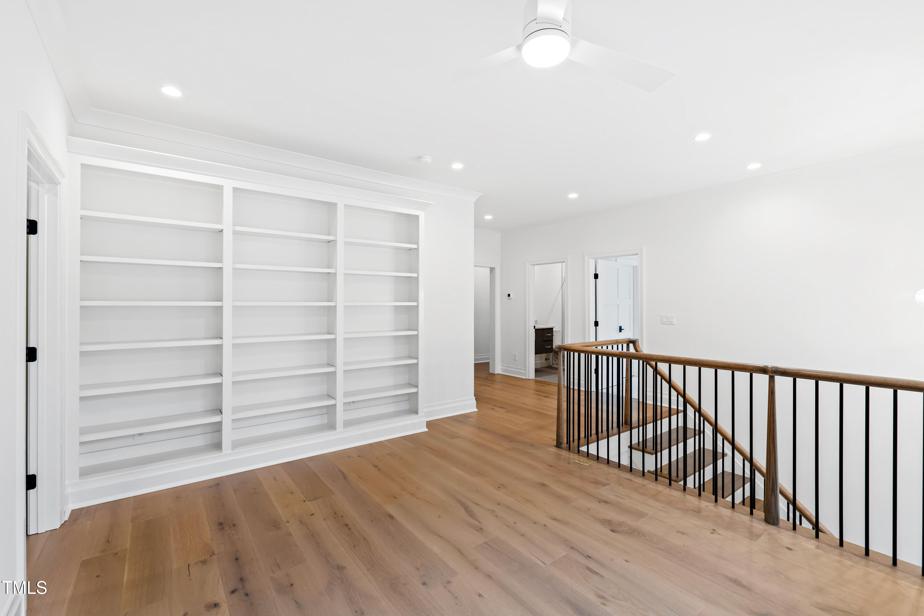2419 Mayview Road Raleigh, NC 27607 - Photo 25 of 55 a view of an empty room with wooden floor and a window