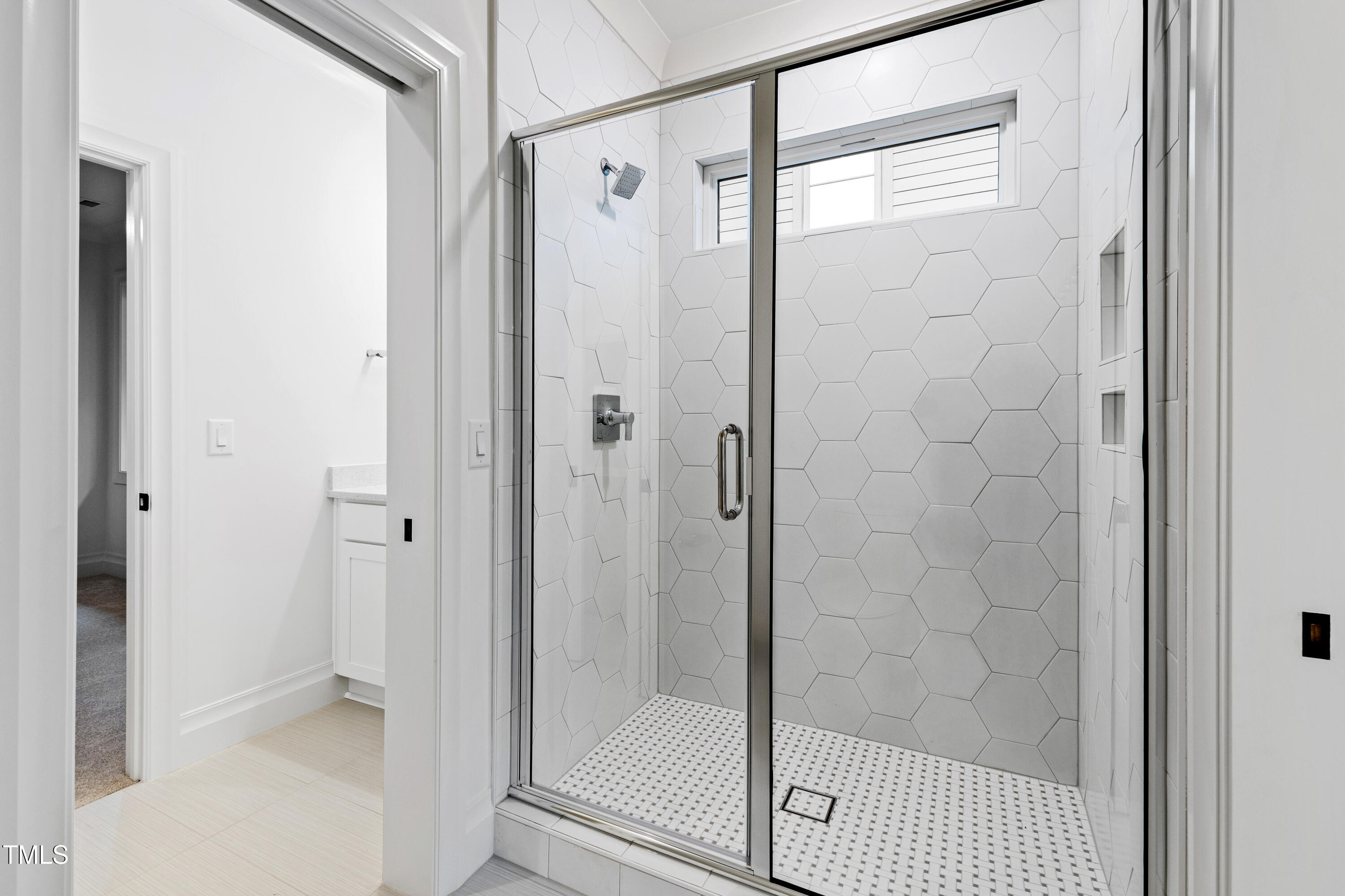 2419 Mayview Road Raleigh, NC 27607 - Photo 38 of 55 a bathroom with a glass shower door