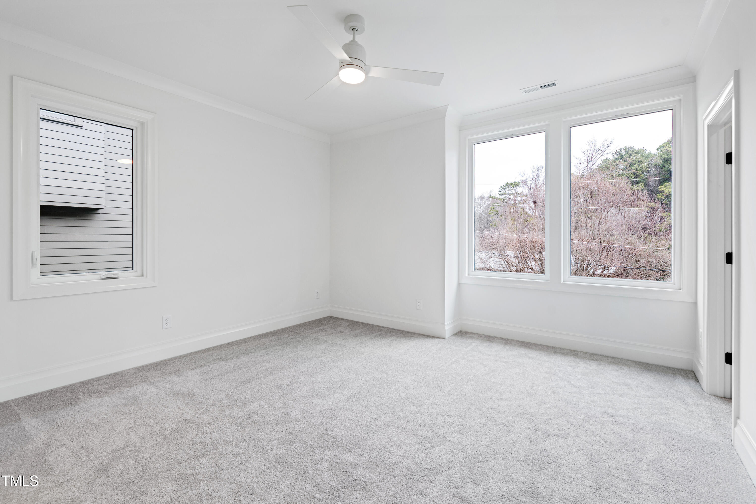 2419 Mayview Road Raleigh, NC 27607 - Photo 41 of 55 an empty room with windows and closet