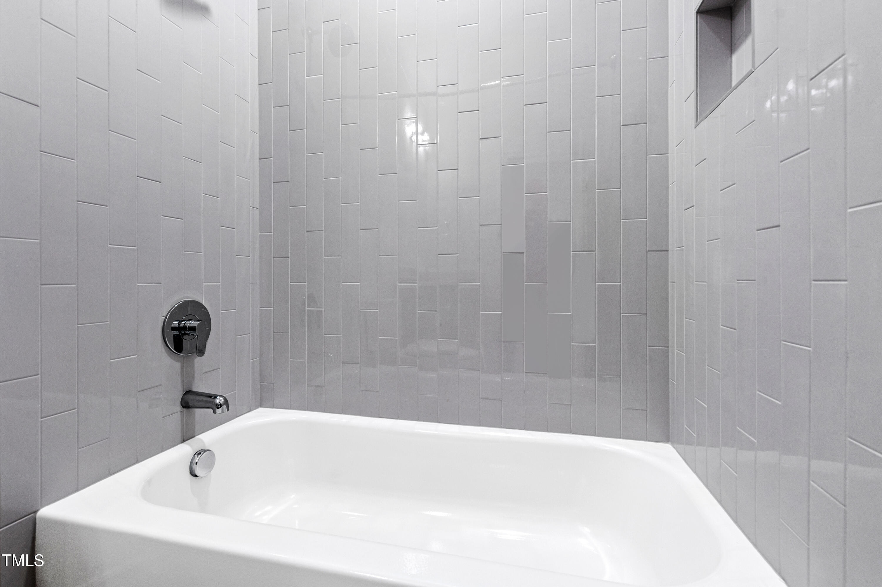 2419 Mayview Road Raleigh, NC 27607 - Photo 47 of 55 a white bath tub sitting in a bathroom and shower